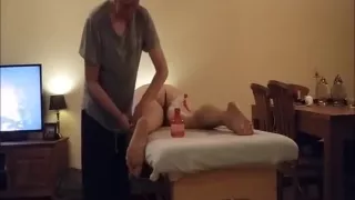 Old guy massages a big ass milf on the table