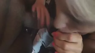 Blonde slut massages two cocks before she's covered in cum