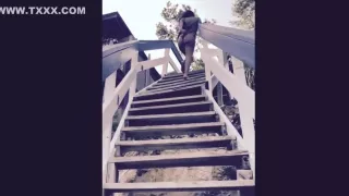 Sexy girl with a huge booty bouncing it at the beach