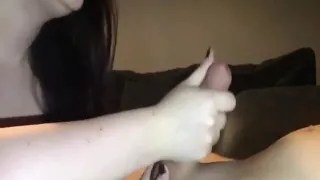 Mature wife jerks a big fat cock with both hands