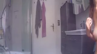 Sexy teen brunette getting ready in the bathroom alone