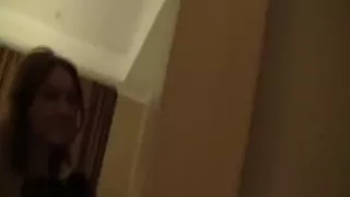 Teen girl having fun dancing naked in a hotel room