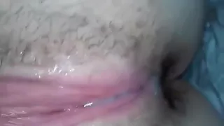 Black guy fingers a very wet and hairy white pussy
