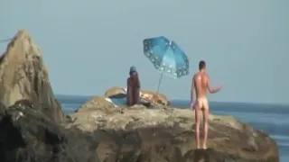 Kinky couple having naughty fun on a nice secluded beach