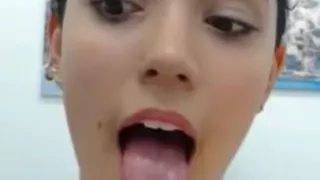 Beautiful Latina teen opens mouth, crosses eyes, and shows sexy feet