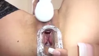 Horny brunette masturbating with vibrator and gaping twat