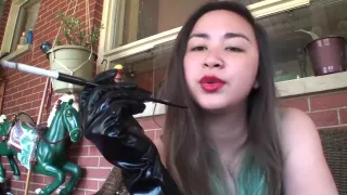 Asian retro smoking with gloves and cigarette holder