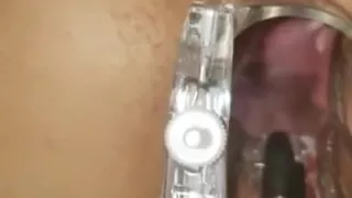 Taking measurements of her open pussy