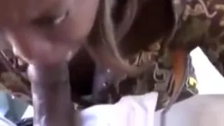 Chocolate hottie opens her mouth to swallow a black bone