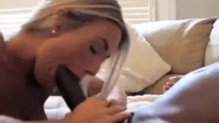 Beautiful spouse patting and licking an enormous dick that