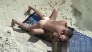 Voyeuring mom with her holiday lover at beach