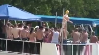 Outdoors water party with many wild teens