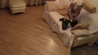 Girl in black stockings masturbates on the couch