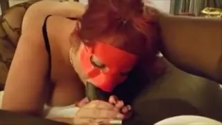 Masked MILF takes that BBC deep in her throat