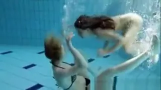 Zuzanna and Lucie playing underwater