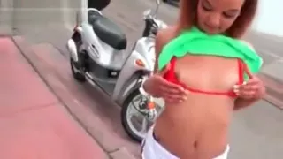 Redhead latina showing off her sexy assets in public