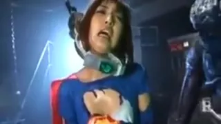 Super hero is put on a torture machine and an alien hurts h