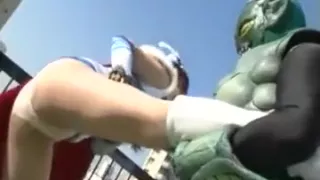 Super heroine gets choked out on the roof and then gets gro