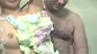 Asian babe roped up and covered in cream