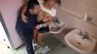 Voluptuous Asian babe has a guy caressing and kissing her b