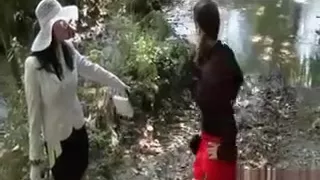 Lesbo Clothed Sluts Get Wet In The River