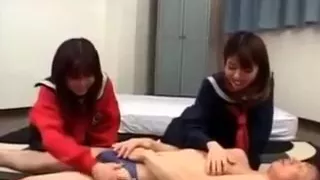 Smiling Asian Teen Girls Sharing A Horny Dude In 3some