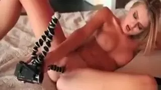 Blonde stunning babe working her cunt with a fuck machine