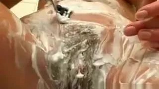 Horny and slutty brunette MILF shaves