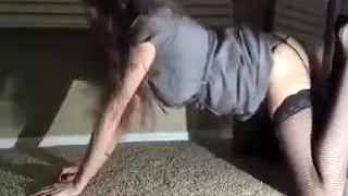 Sexy curly haired brunette fucks herself with dildo