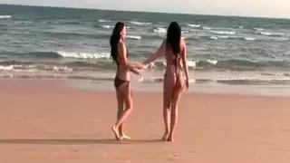 Teen lesbo sweeties kissing in the sea