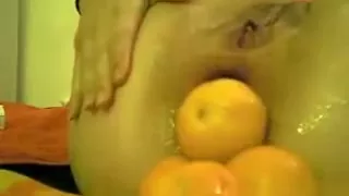 Huge dildo and mandarins in my asshole