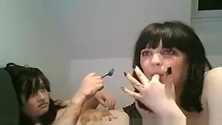 Two brunette EMO babes have fun smearing