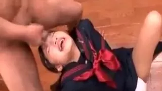 Teen asian brunette taking a hot messy facial on the floor
