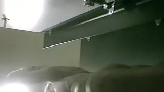 Busty chick is filmed by a spy cam changing her clothes in