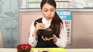 Asian gal is eating noodles with a dick in her face while d
