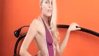 Blue eyed beauty Sasha posing sexy in a tiny body suit