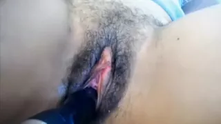 Hairy Pussy Is Being Teased With A Dildo