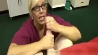 Mature nurse gives a handjob to her horny patient