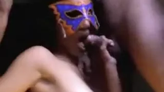Mixed Asian babe wearing a mask gets fucked deep against the wall and sucks white dick