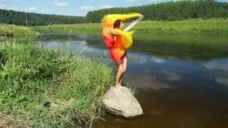 Dance with Colors Fans on boulder in river