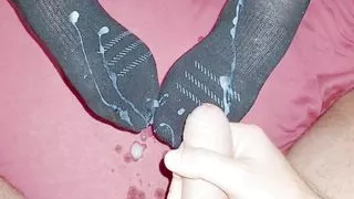 StepMom put on black socks and made a sockjob for the StepSon
