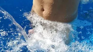 German Guy in the swimming pool enjoying the Waterfall