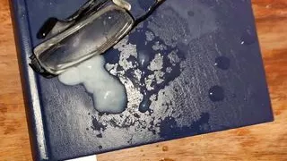 Cum on old pair of glasses and Mormon Book.