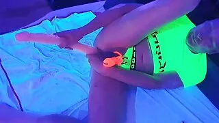 Lisa helps Mike playing with his big boys toys whilst locked in glow in the dark chastity cage