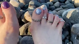 Hot and sexy feet of Mistress Lara in the sunset on public beach