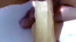 Bouncing on a think dildo