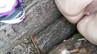 Pussy whipping on a woodpile