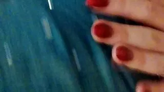 Morning homemade striptease in an orange sweater and jeans. Close-up