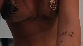 Evening beautiful homemade striptease in charming lingerie. Close-up