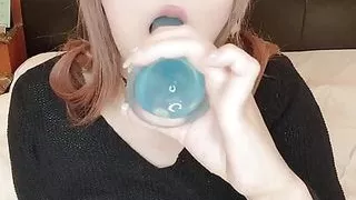 She sucks the dildo hard in her mouth